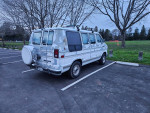 1992 Dodge Ram Van B250 Mark III camper parked in a lot, showcasing its vintage design and well-maintained exterior.