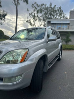 Silver 2006 Lexus GX 470 4WD parked, showcasing its well-maintained exterior and new tires.