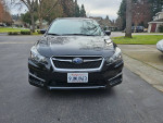 2016 Subaru Impreza Hatchback in black, low mileage, features backup camera, Bluetooth, and new tires.