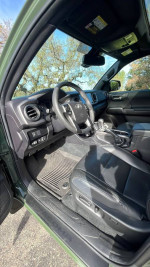 Interior view of a 2022 Toyota Tacoma TRD Off Road showcasing leather seats and modern dashboard design.