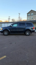 Chrysler Aspen SUV parked with new tie rods, power features, and some rust spots, priced at $4,800.