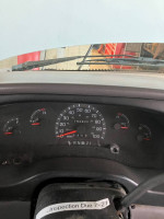 Dashboard view of a 1997 Ford E-350 with low mileage and strong engine performance.