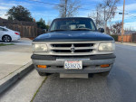 1997 Mazda B4000 pickup truck with manual transmission for sale, runs great with 140k miles and reliable performance.