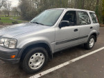 2001 Honda CRV with low mileage, clean title, automatic, and well-maintained features, parked in a scenic area.