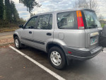 2001 Honda CRV with clean title, all-wheel-drive, parked in a lot, showcasing its exterior features.