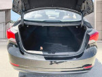Open trunk of a 2013 Hyundai Elantra showcasing spacious cargo area.