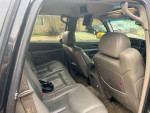 Interior view of a 2006 GMC Yukon Denali, showcasing spacious heated leather seating and DVD entertainment system.