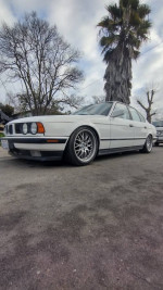 1989 BMW 535i with custom BBS wheels parked outdoors, showcasing clean exterior and unique design.
