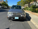 Front view of a 2007 BMW X3 3.0si AWD SUV parked on a residential street