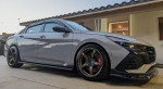 2023 Hyundai Elantra N in perfect condition with custom wheels and carbon accents, parked outside.