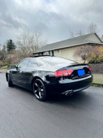 2012 Audi A5 Premium coupe in black with new wheels, panoramic roof and winter-ready features