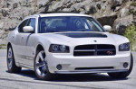 Rare 2009 Dodge Charger R/T DAYTONA in Stone White, featured on a scenic road.