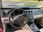 Interior view of a 2012 Mazda CX-7 showing dashboard and controls, with 89,000 miles displayed.