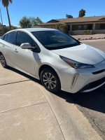 2019 Toyota Prius XLE FWD parked in excellent condition with factory roof rack attachments