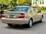 2002 Toyota Camry SE FWD in beige with flawless exterior and interior, low mileage, perfect for commuting.