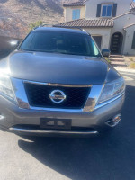 Front view of a 2016 Nissan Pathfinder Platinum, showcasing its sleek design and features.