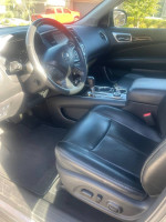 Interior view of a 2016 Nissan Pathfinder Platinum with leather seats and advanced features