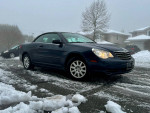 2008 Chrysler Sebring Convertible LX parked in snowy conditions, showcasing excellent mechanical state and clean appearance.