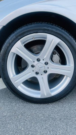Close-up of the alloy wheel of a 2007 Mercedes-Benz CLS550 with a low mileage of 84,000 miles.
