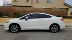 2012 Honda Civic Si Coupe in white with excellent exterior condition parked on a residential street.