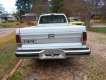 Rear view of a well-maintained 1982 GMC S-15 Sierra Classic Pickup Truck in white color