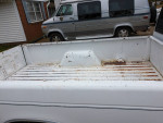 View of the bed of a 1982 GMC S-15 Sierra Classic pickup truck, showcasing a well-maintained interior.