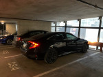 2016 Honda Civic EX parked in a garage, featuring a sleek black exterior and low mileage.